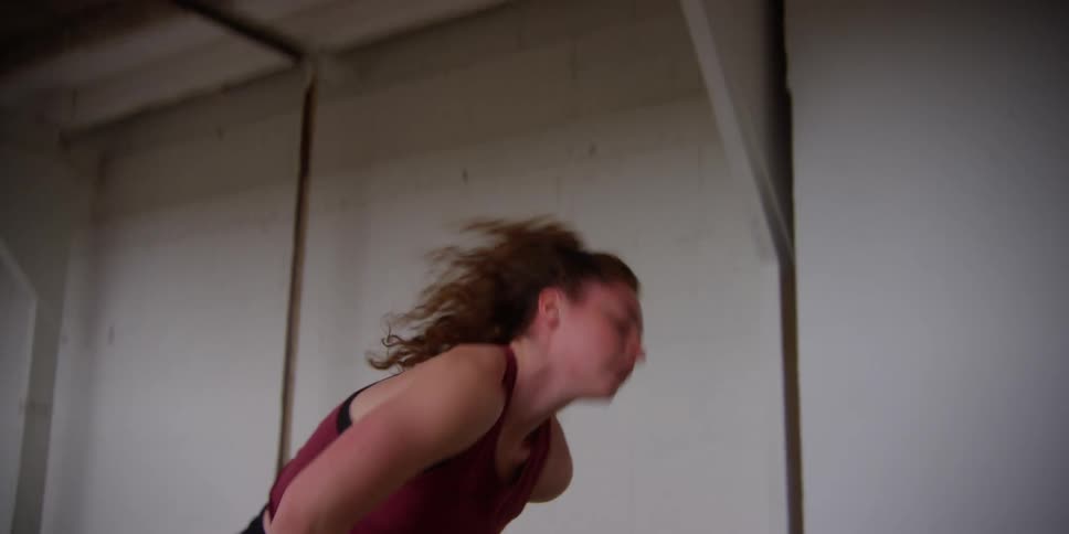 A dancing doing a choreography that includes a cartwheel