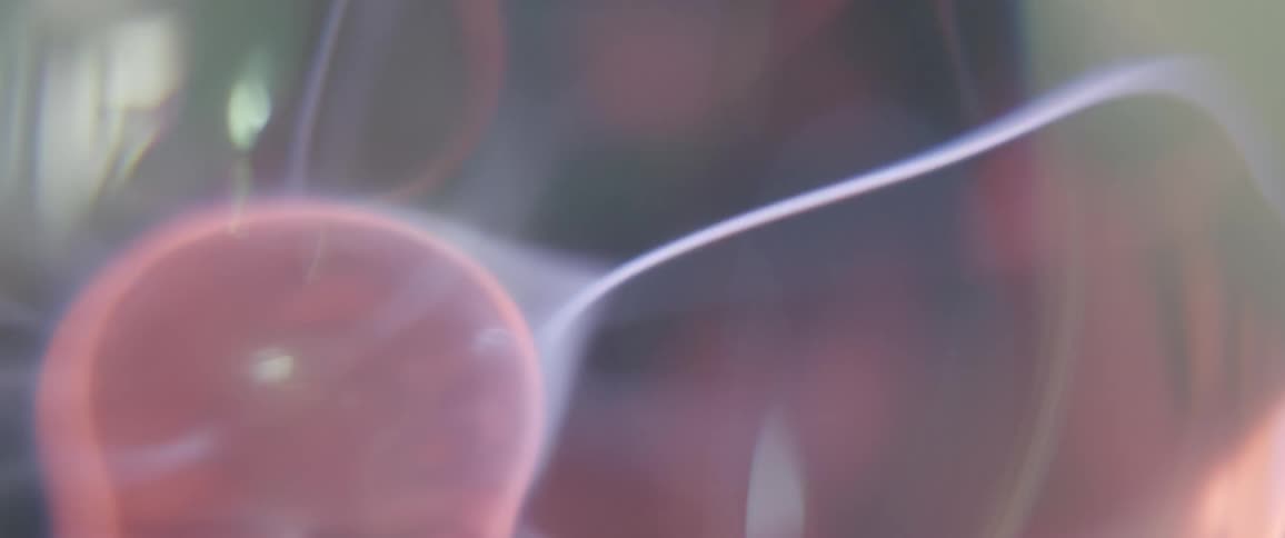 Strands of electrical energy emerge from a pink rotating orb