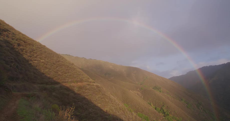 A rainbow over a mountain range