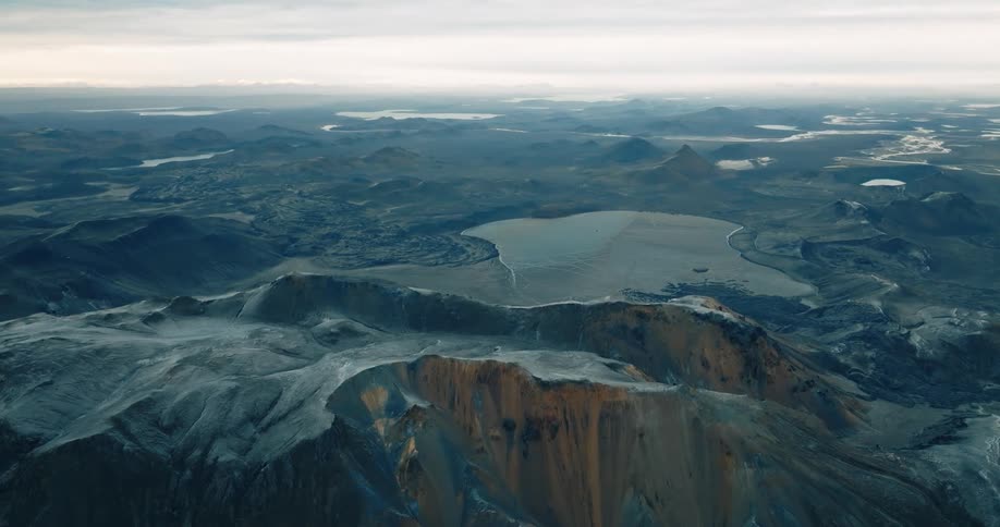 A cloudy day over a mountainous lake region