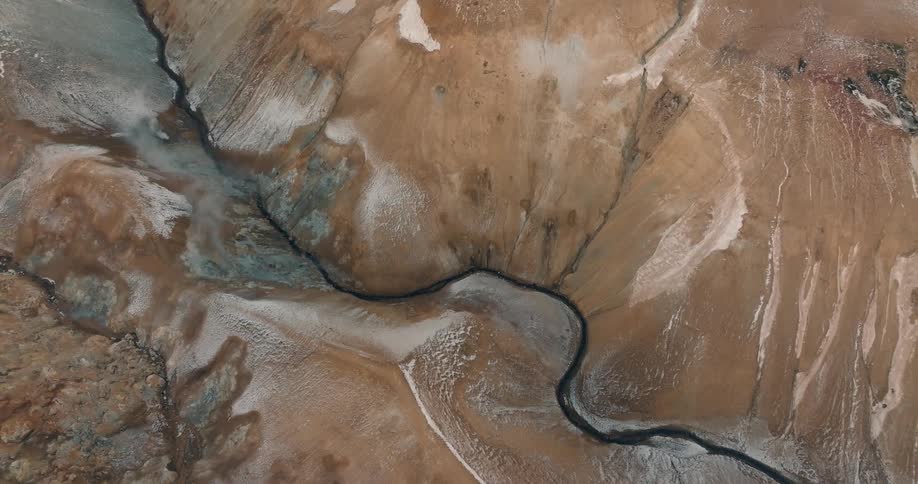 Steam rises from the canyon