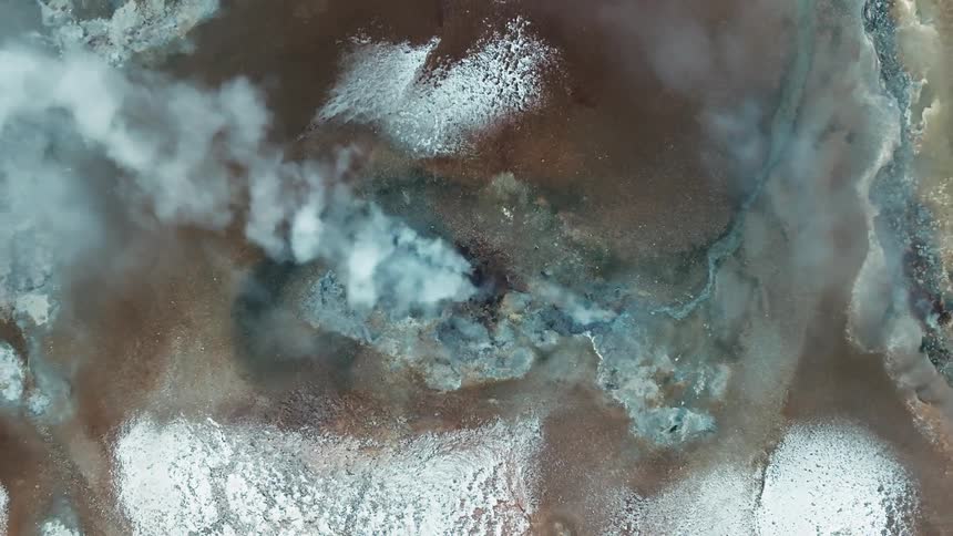 Steam is rising from the ground