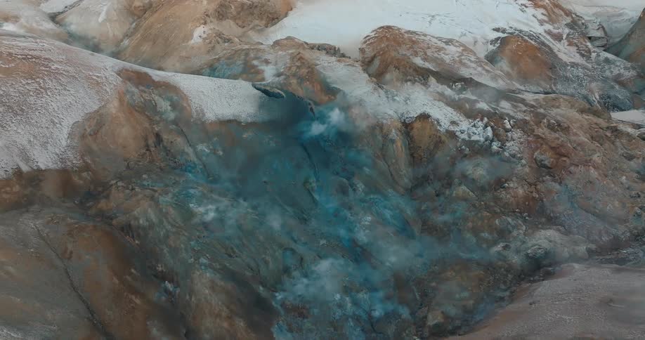 Steam rises from the mountain