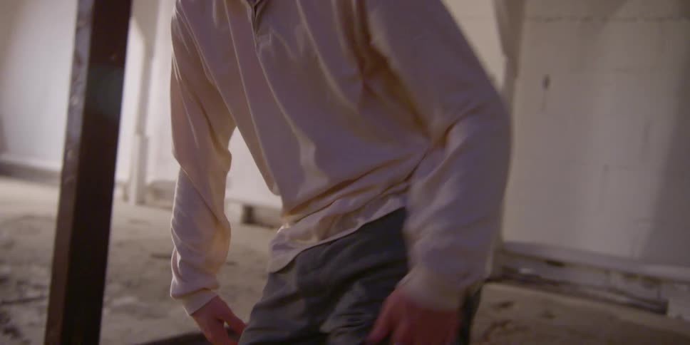 Young man dancing a choreography indoors