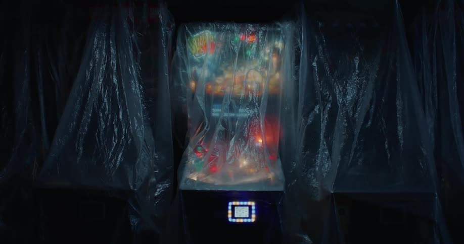 An arcade machine covered in clear plastic