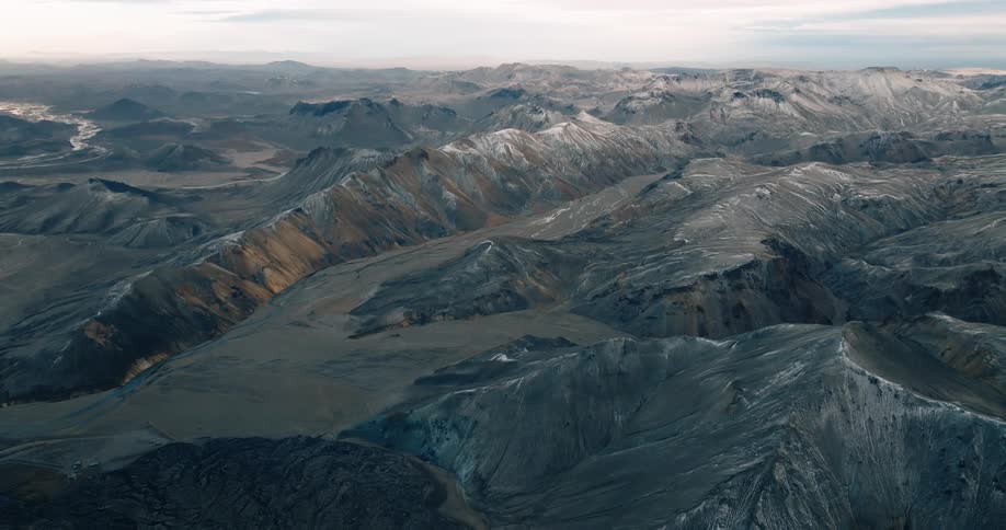 A rugged mountainous landscape under a cloudy sky