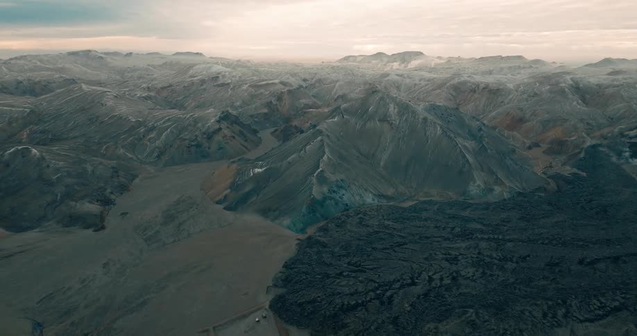 Aerial view of a rugged mountainous landscape at sunset