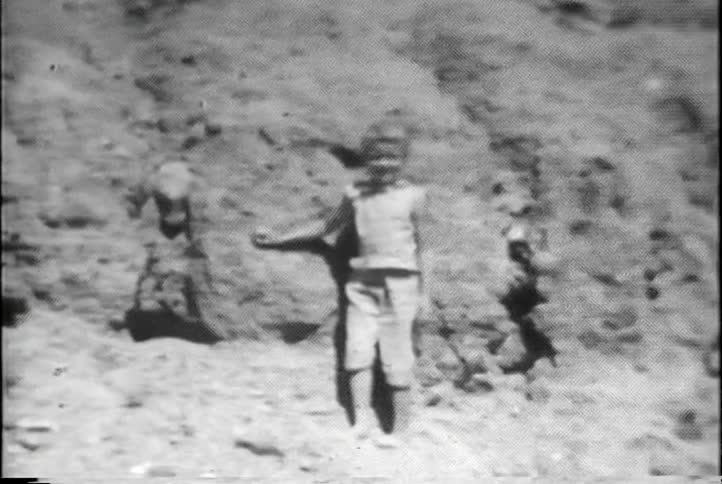 Young person standing and posing  on a hillside