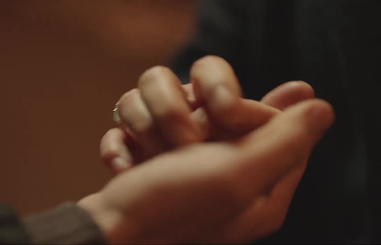 Hands clasped in a massage