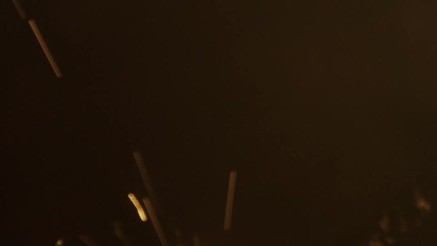 Extreme closeup on a celebration candle burning and sparking