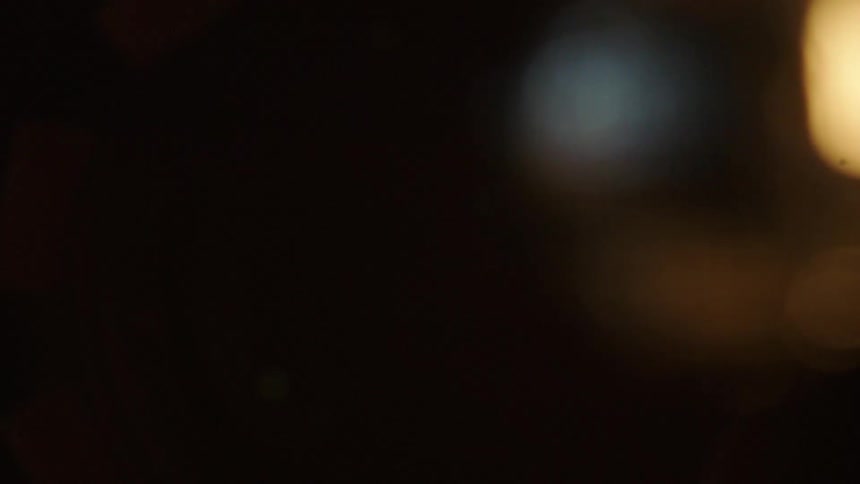 Small reflections of lights in an abstract and blurry closeup