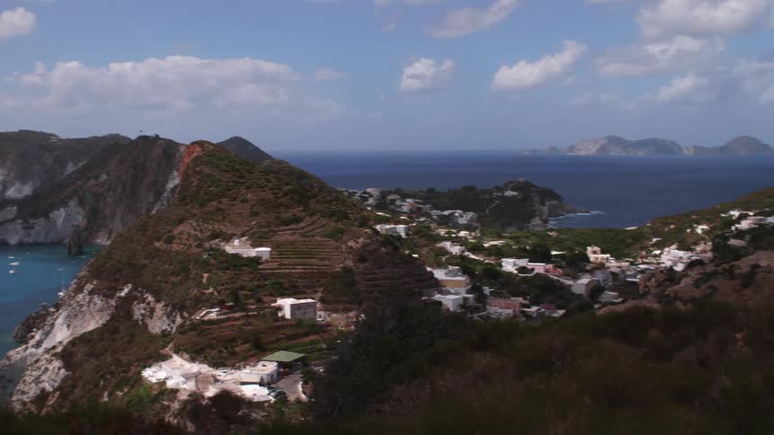 A residential area on a peninsula facing the sea with lots of vegetation