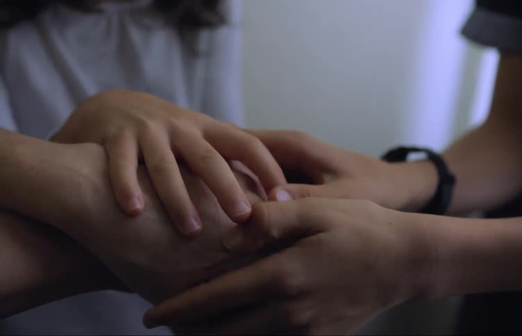 A group of people holding hands