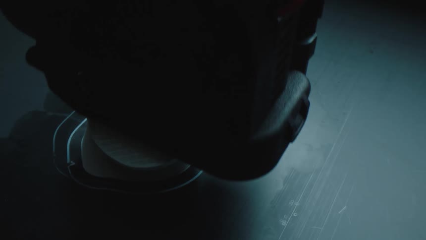A machine polishes a white object