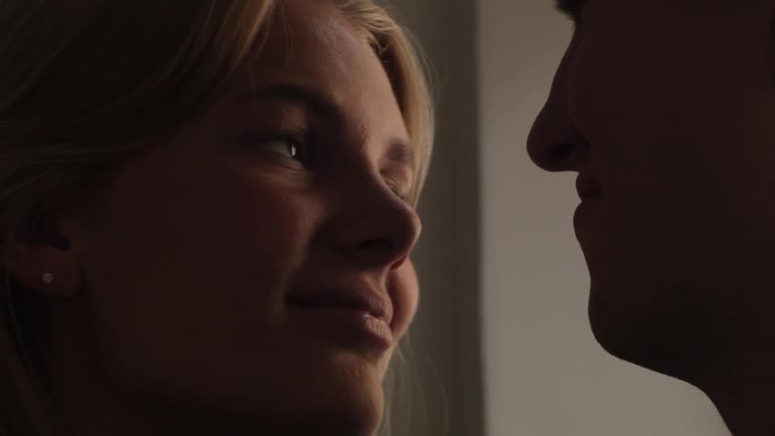 A dancing couple looking at each other with love