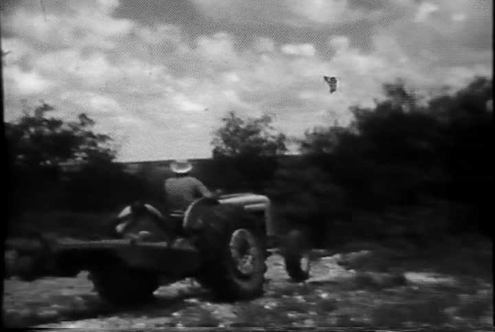 A man rides a tractor