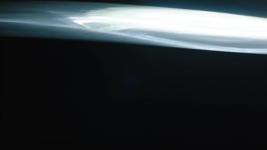 A fast light moving around a dark background