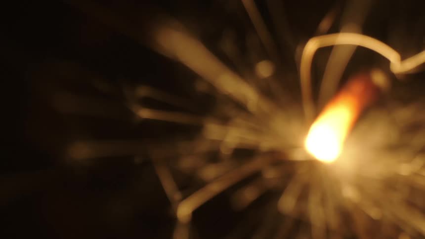 Celebration candle burning giving off sparks
