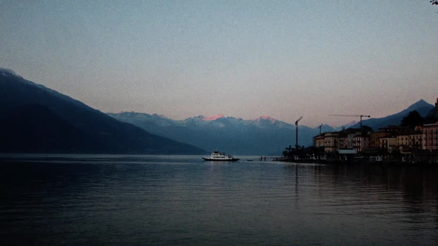 A boat is docked near the small town