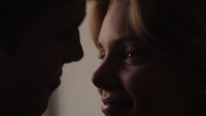 A romantic moment with a couple close together about to kiss