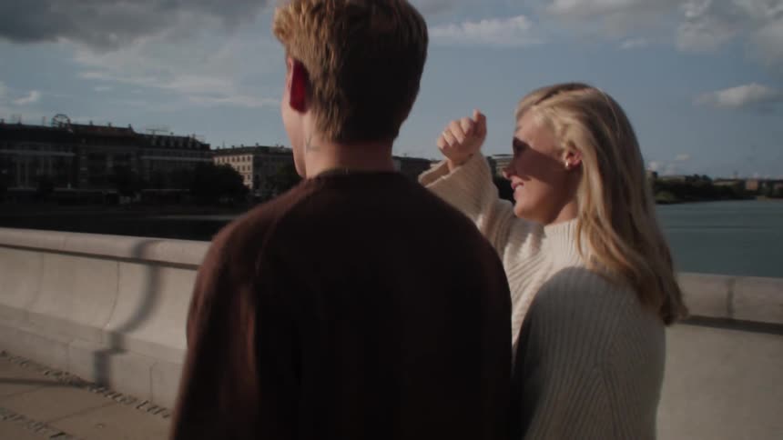 Couple walking on a bridge during the day