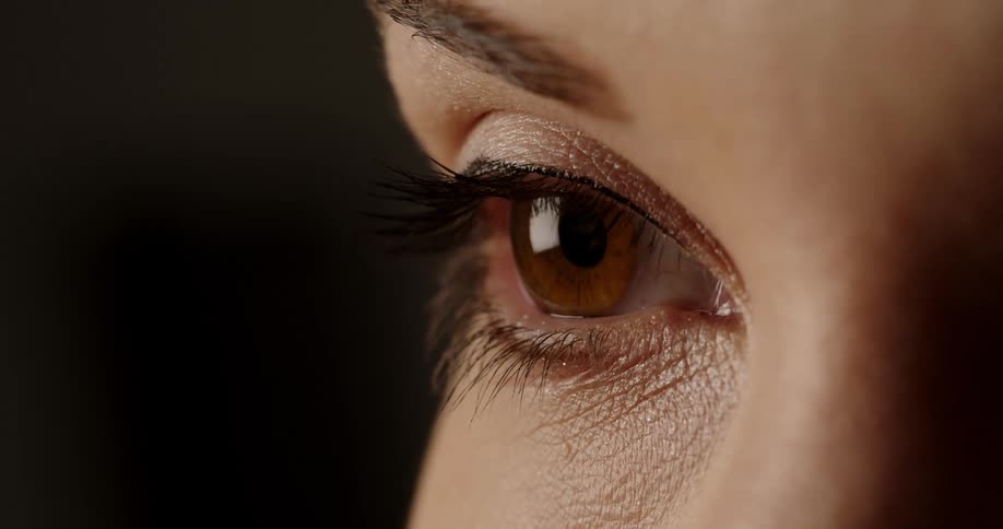 A closeup of a womans eye with makeup on it