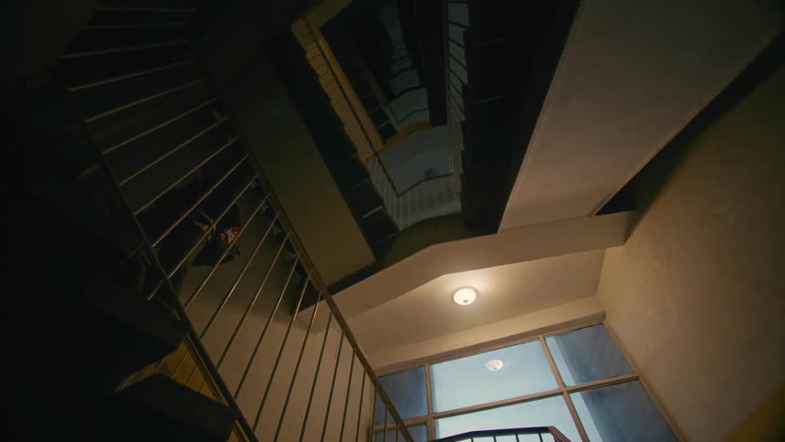Little boy climbing the stairs of a building