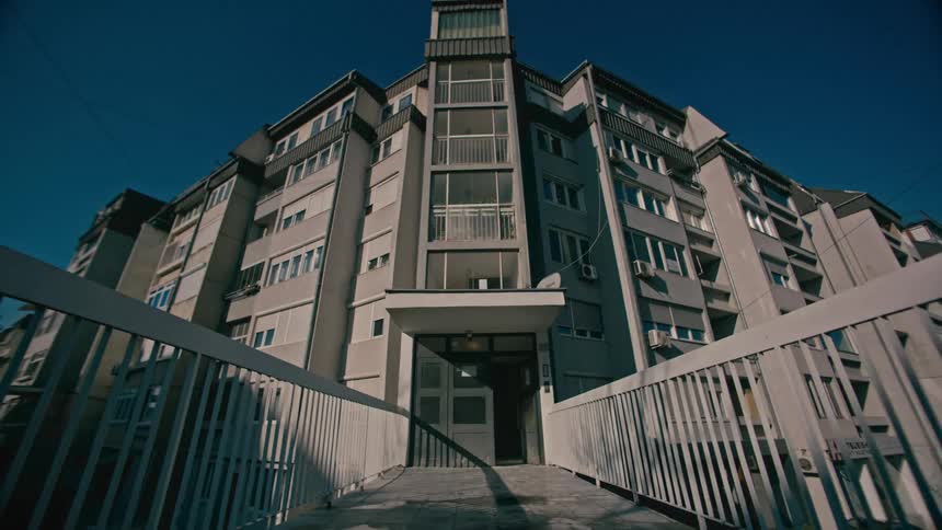 A view of a large building outdoors on a sunny day