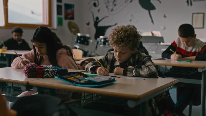 Children in the classroom copying homework