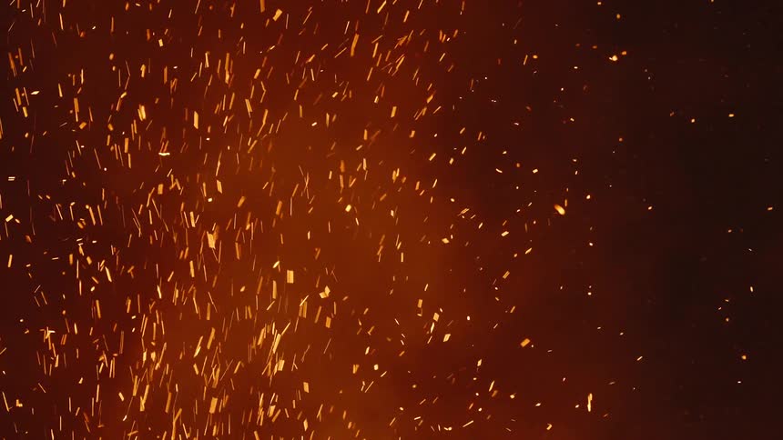 Sparks from a fire during the smoky night