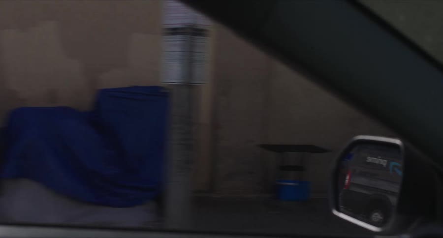 View from inside a moving car of streets and alleys