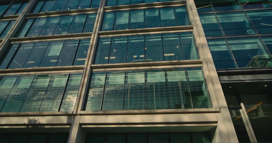External architecture of a mirrored commercial building with solar reflection