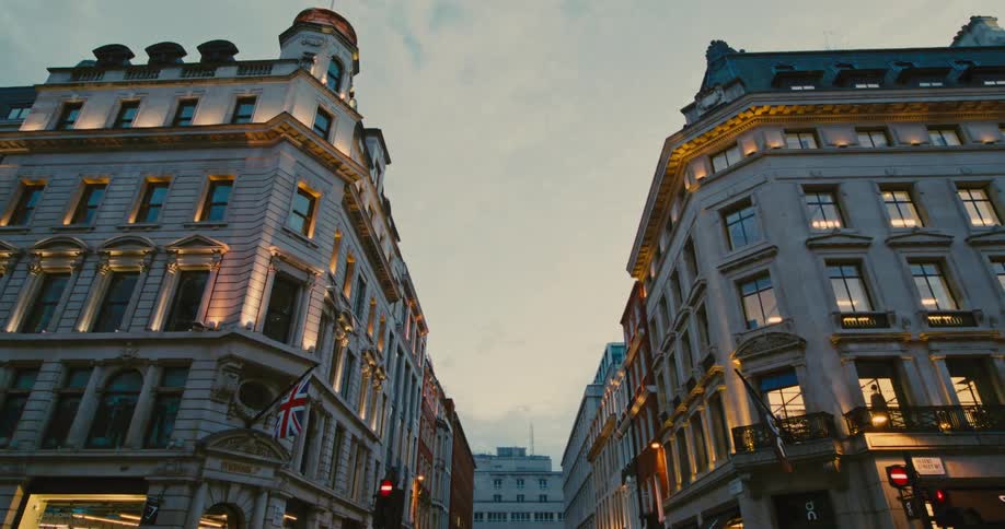 Exterior of apartment buildings in the street at dusk