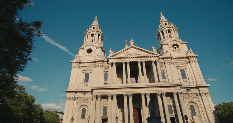 Cathedral on a square with bell towers and clock
