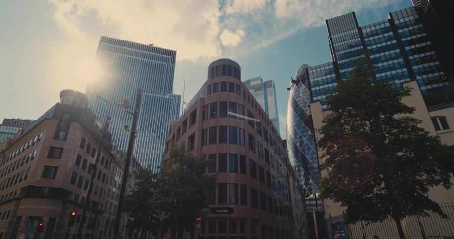 A london street with a view of the gherkin