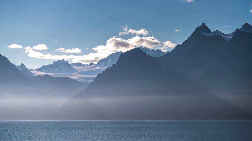 Water surrounds the mountains