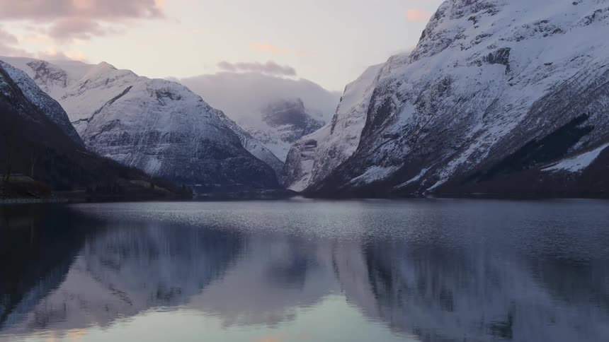 A lake is by the mountain