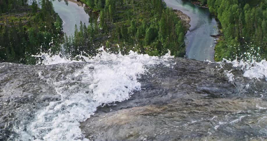 The waterfall pours down into the rivers