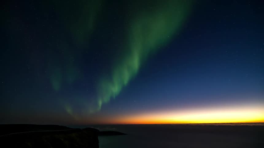 The sky is green with aurora
