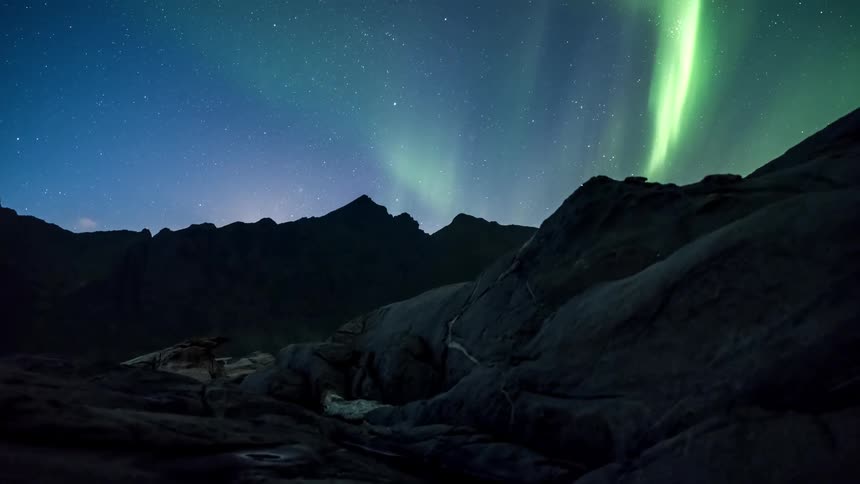 The aurora reflects off the water