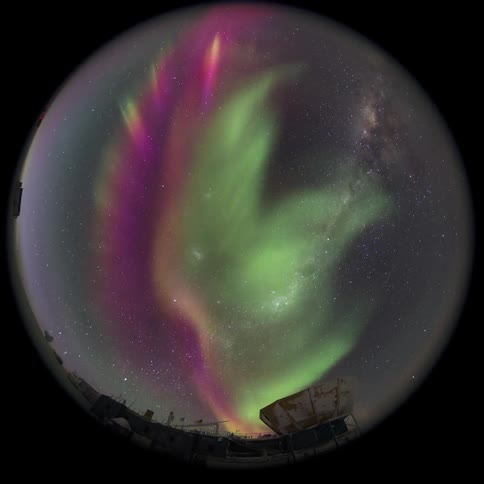 fisheye view of the Aurora Australis from above an observatory