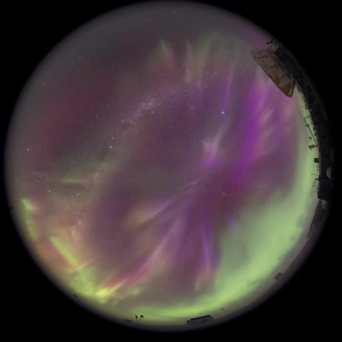fisheye view of the milkyway with Aurora Australis at the south pole