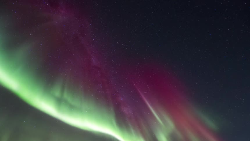 Night sky landscape with nebula and greenish and purple Aurora Australis