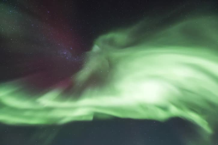 Aurora Australis shining under a night sky