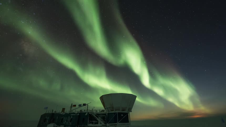 An aurora in the sky over an observation facility