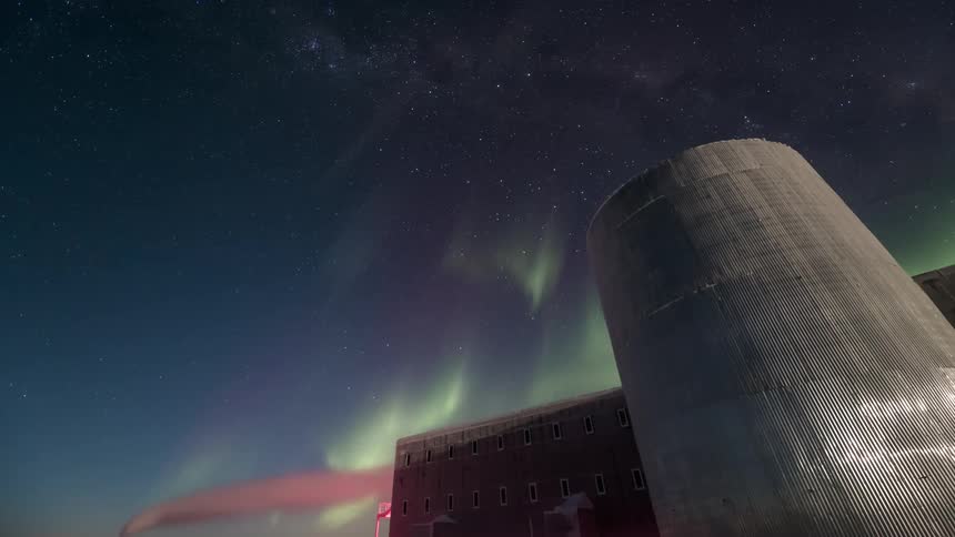 An aurora over a building