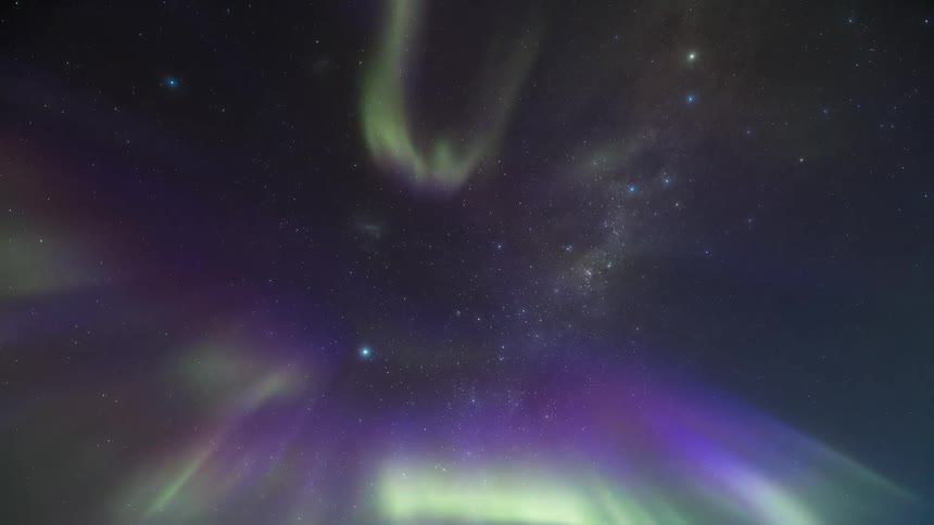 An aurora lights up the night sky