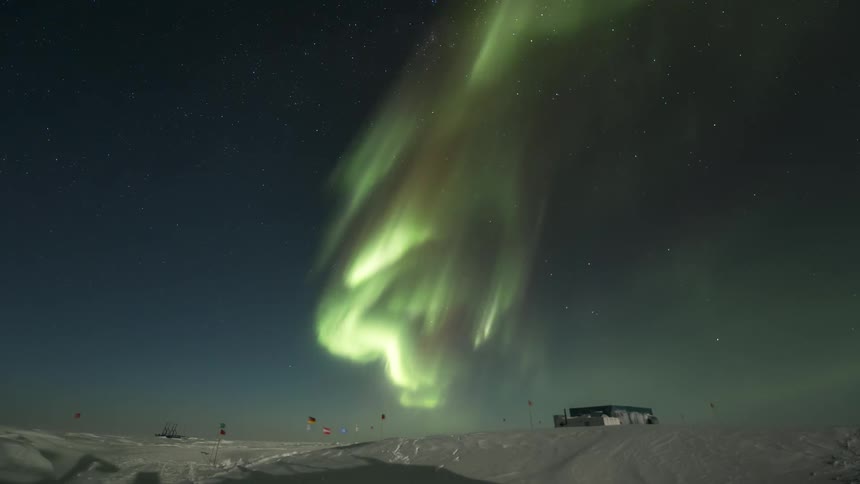 Aurora Australis shining above a research station