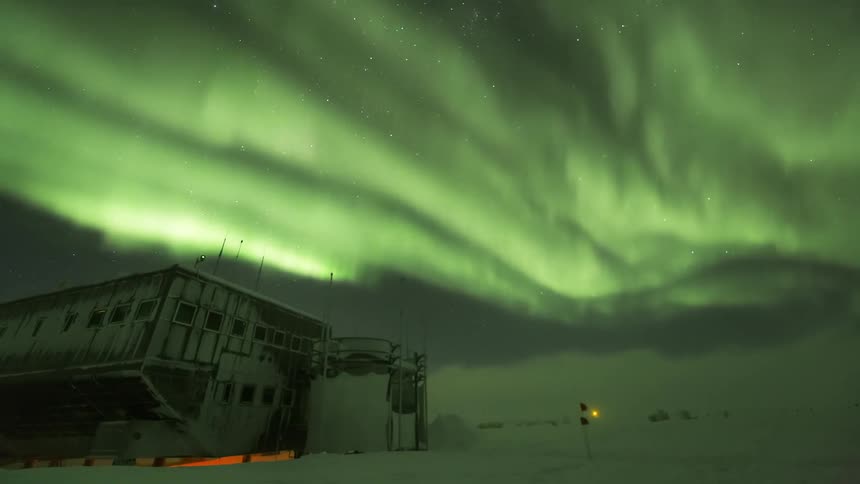 A building is under the green aurora