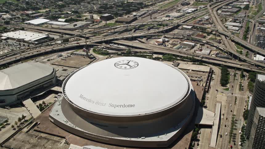 A large stadium sits inside a city